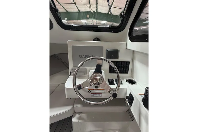 Slide: The Image of Interior view of 2027 Parker 227 Explorer boat cockpit with Garmin navigation system. - 12
