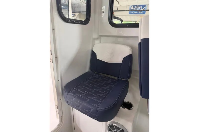 Slide: The Image of 2027 Parker 227 Explorer boat seat with blue and white upholstery. - 14