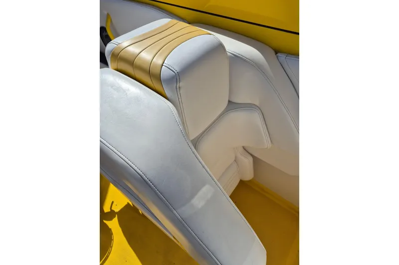 Slide: The Image of White and yellow leather seat in 1999 Fountain 47 Lightning boat interior. - 8