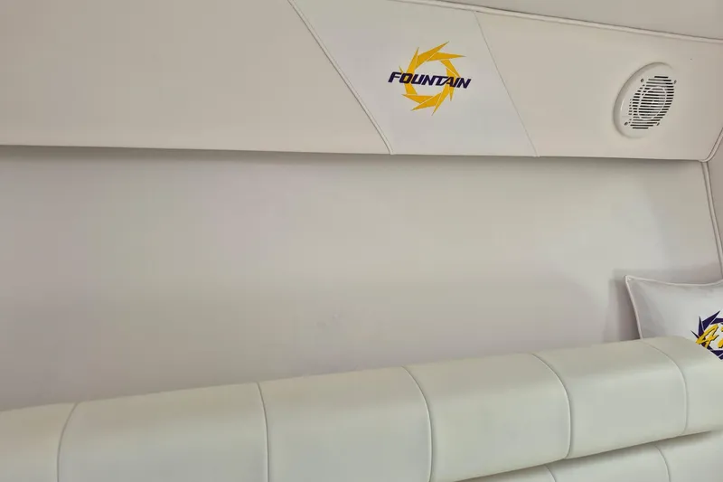 Slide: The Image of Interior of 1999 Fountain 47 Lightning boat with logo and speaker detail. - 11
