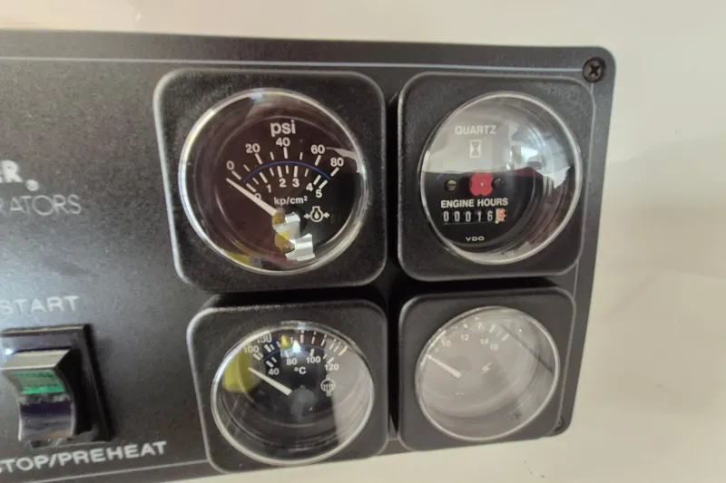 Slide: The Image of Instrument panel of a 1999 Fountain 47 Lightning boat showing gauges and engine hours. - 5