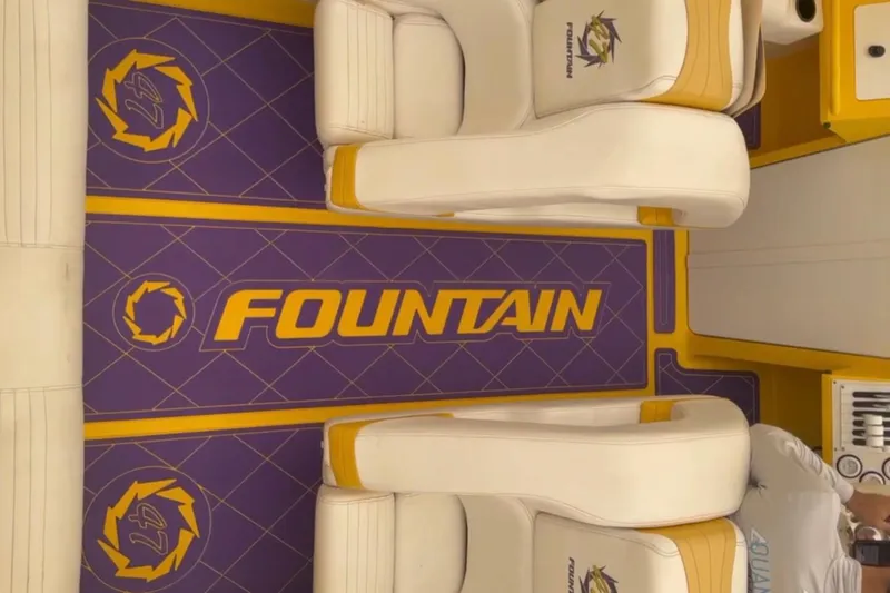 Slide: The Image of Interior of a 1999 Fountain 47 Lightning boat with branded seating and flooring. - 3