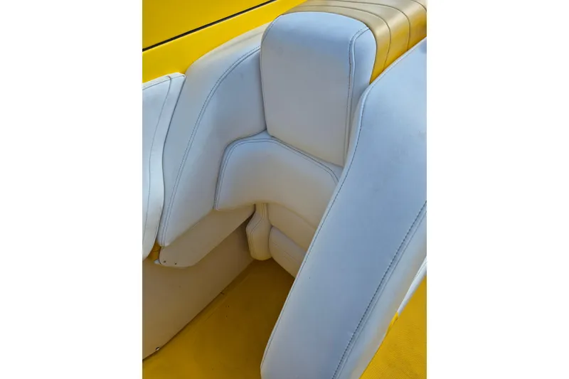 Slide: The Image of White and yellow seating in 1999 Fountain 47 Lightning boat. - 7
