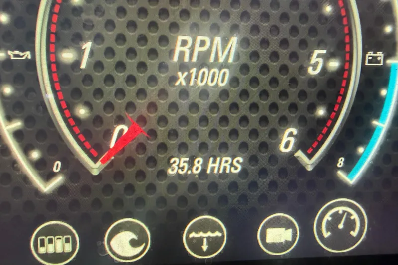 Slide: The Image of Close-up of 2022 Malibu Wakesetter 23 LSV tachometer showing 35.8 hours and RPM gauge. - 30