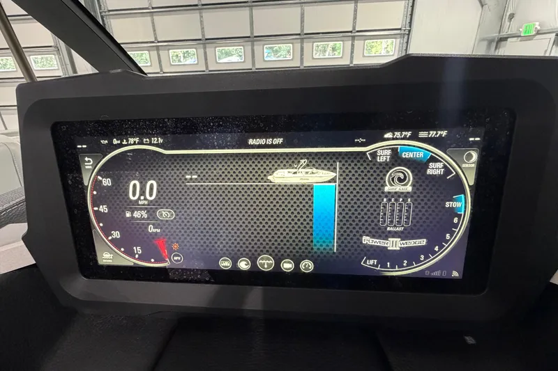 Slide: The Image of 2022 Malibu Wakesetter 23 LSV dashboard display showing speed, ballast, and surf settings. - 23