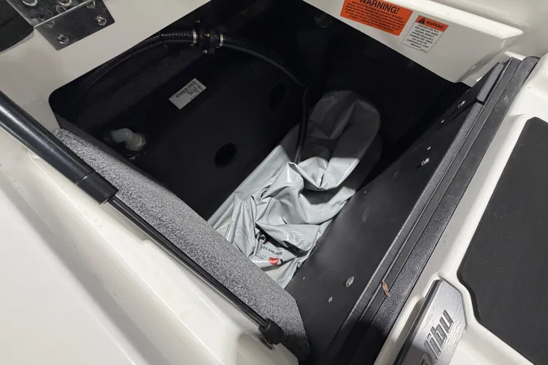 Slide: The Image of Storage compartment of a 2022 Malibu Wakesetter 23 LSV boat, featuring interior details. - 16