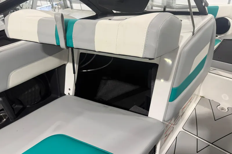 Slide: The Image of 2022 Malibu Wakesetter 23 LSV interior with white and teal seating. - 17