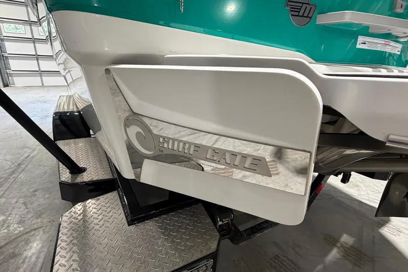 Slide: The Image of 2022 Malibu Wakesetter 23 LSV with Surf Gate technology in a garage setting. - 4