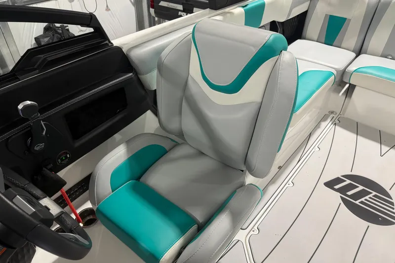 Slide: The Image of 2022 Malibu Wakesetter 23 LSV interior with teal and gray seating, showcasing modern design. - 26