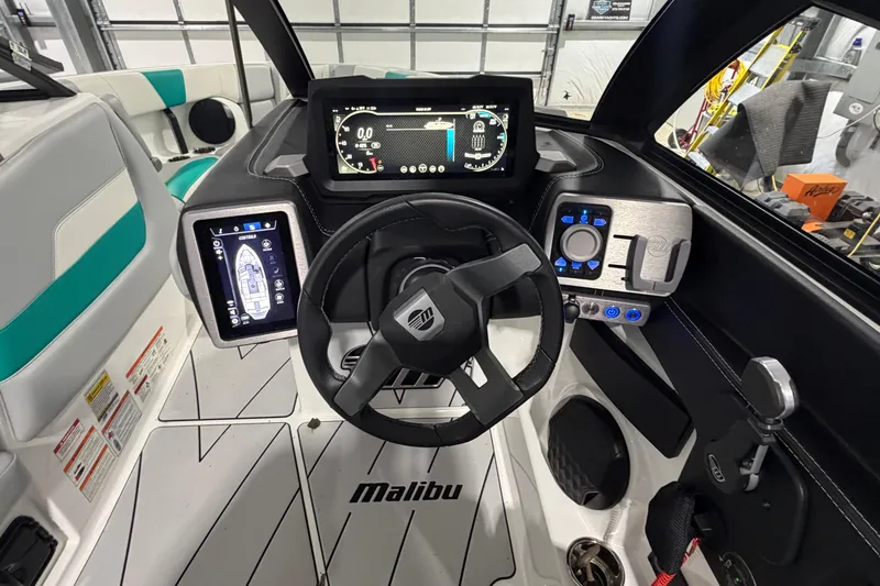 Slide: The Image of Interior view of 2022 Malibu Wakesetter 23 LSV boat dashboard and controls. - 22