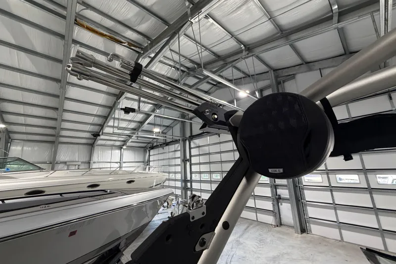 Slide: The Image of 2022 Malibu Wakesetter 23 LSV in a spacious indoor storage facility. - 12