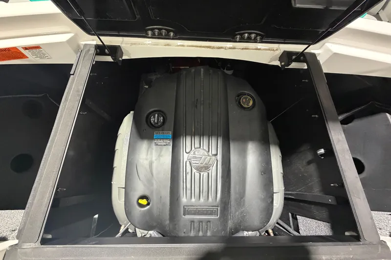 Slide: The Image of Engine compartment of 2022 Malibu Wakesetter 23 LSV boat, showcasing engine details. - 21