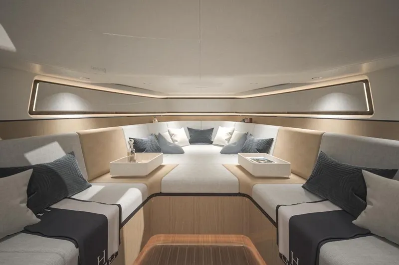 Slide: The Image of Luxurious interior of 2027 CNM Continental Tender yacht with elegant seating and cushions. - 1