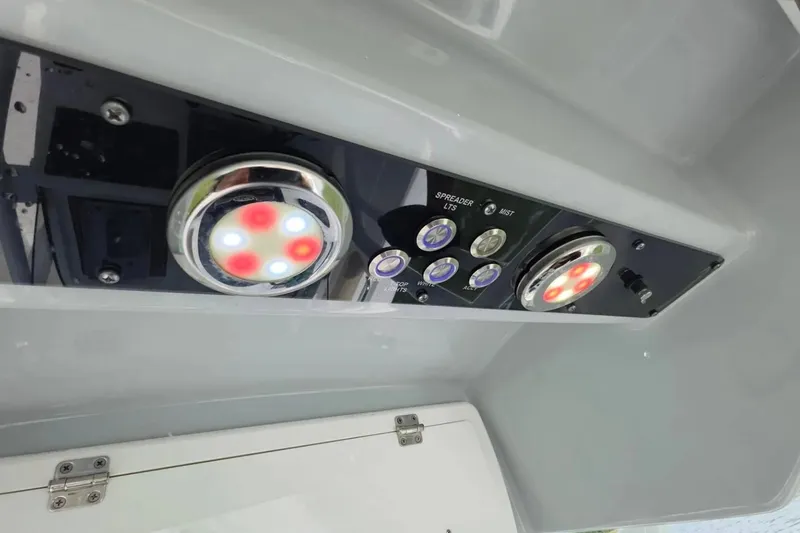 Slide: The Image of Control panel of a 2017 Sea Fox 226 Commander boat with illuminated buttons and lights. - 28