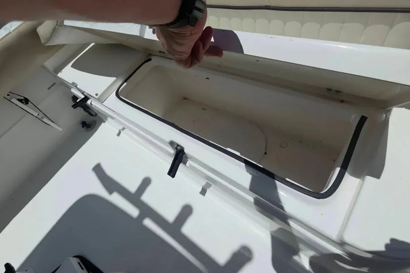 Slide: The Image of Open storage compartment on a 2017 Sea Fox 226 Commander boat. - 37