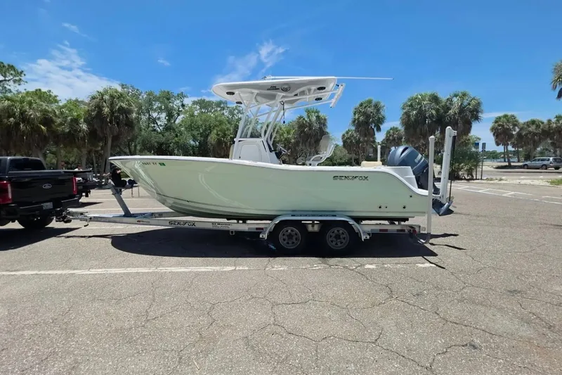 Slide: The Image of 2017 Sea Fox 226 Commander boat on trailer in sunny parking lot. - 2