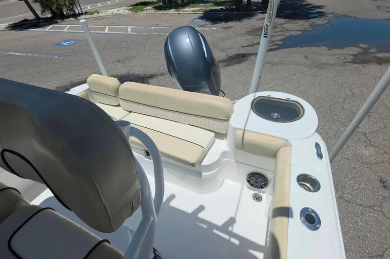 Slide: The Image of 2017 Sea Fox 226 Commander boat interior with seating and motor view. - 9
