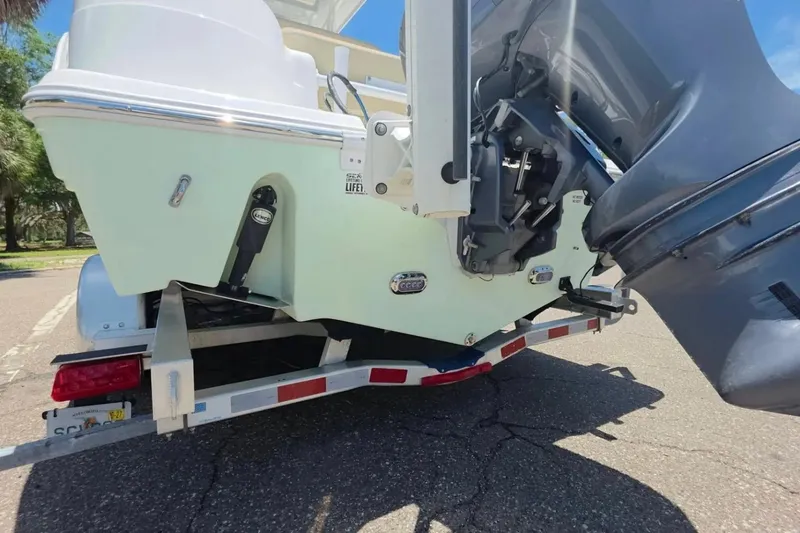 Slide: The Image of 2017 Sea Fox 226 Commander boat on trailer, showcasing outboard motor and hull details. - 5