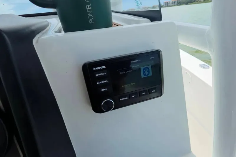 Slide: The Image of Kicker media center on 2017 Sea Fox 226 Commander boat dashboard with Bluetooth pairing. - 21