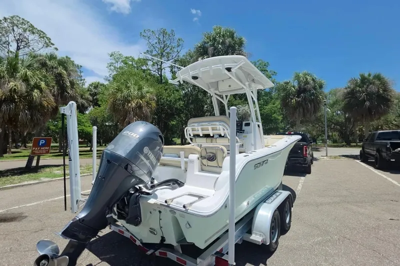 Slide: The Image of 2017 Sea Fox 226 Commander boat with Yamaha engine on trailer in sunny parking lot. - 6