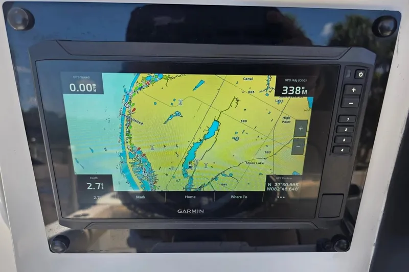 Slide: The Image of Garmin GPS display on 2017 Sea Fox 226 Commander boat, showing navigation map and coordinates. - 18