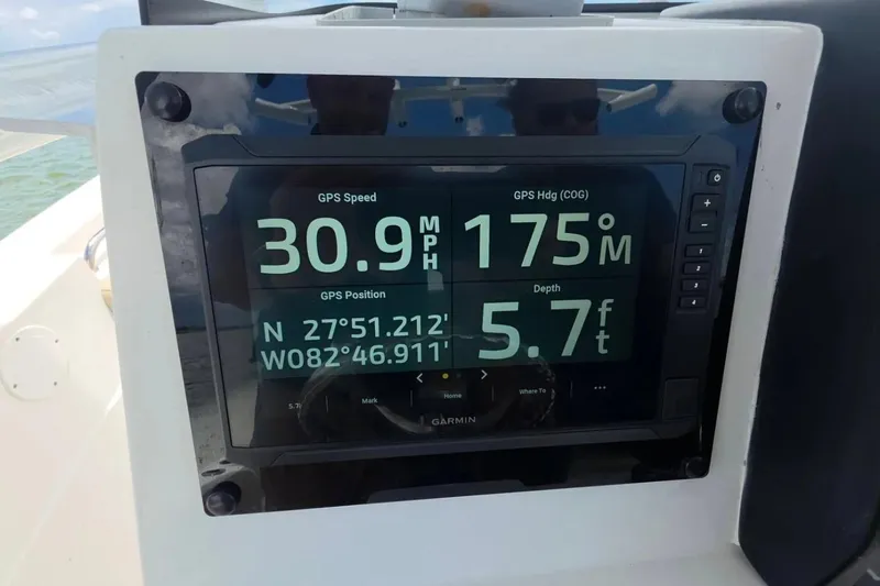 Slide: The Image of Garmin GPS display on 2017 Sea Fox 226 Commander showing speed, heading, and depth. - 23