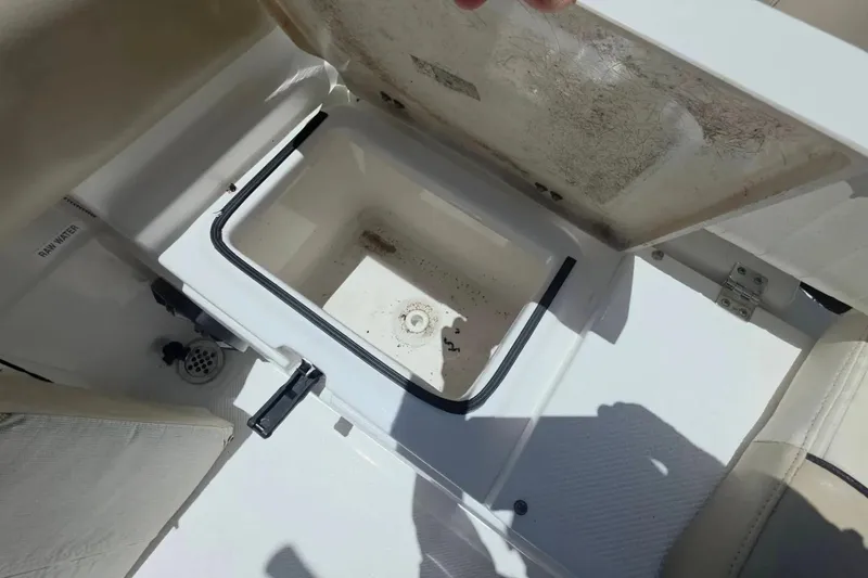 Slide: The Image of Open storage compartment on 2017 Sea Fox 226 Commander boat, showing interior details. - 11
