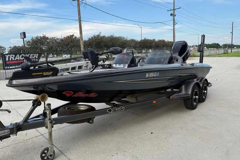 Slide: The Image of 2008 Bass Cat Pantera IV fishing boat on trailer, parked outdoors. - 5
