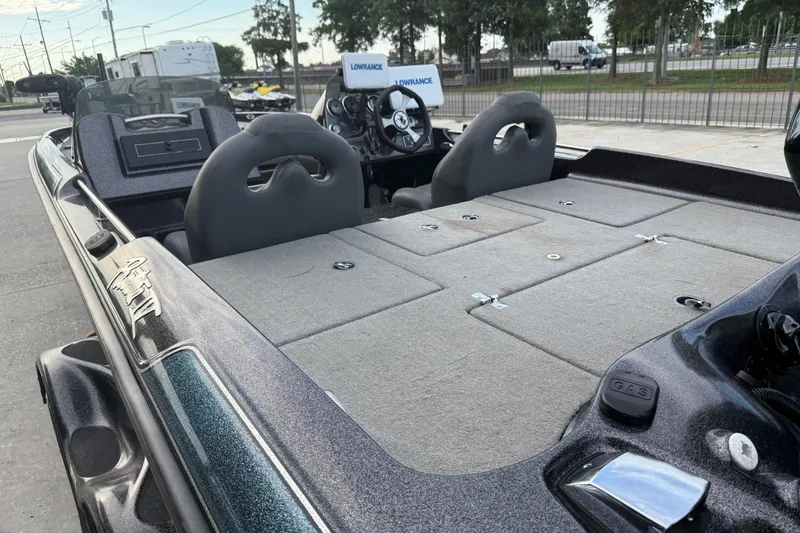 Slide: The Image of 2008 Bass Cat Pantera IV boat interior with seating and control panel, featuring Lowrance equipment. - 9