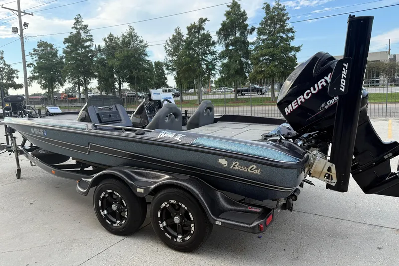 Slide: The Image of 2008 Bass Cat Pantera IV boat with Mercury engine on trailer. - 7