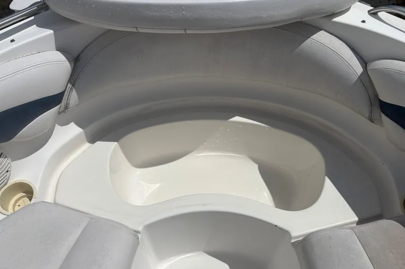 Slide: The Image of Interior seating of a 2000 Chaparral 230 SSi boat, featuring white upholstery. - 17