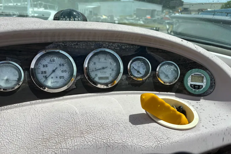 Slide: The Image of Dashboard of a 2000 Chaparral 230 SSi boat with gauges and compass. - 22