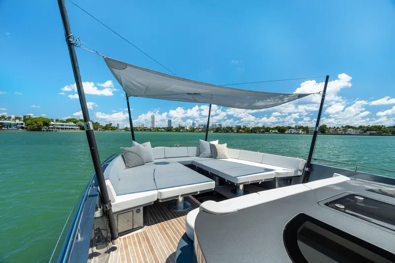 Slide: The Image of Luxurious 2024 CNM CONTINENTAL 54 SuperSport yacht with spacious deck and sunshade on open water. - 49