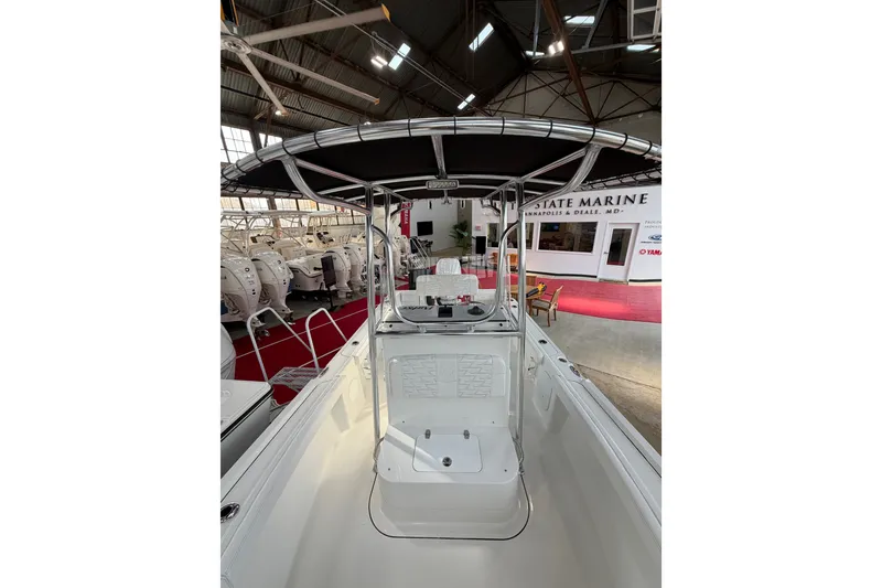 Slide: The Image of 2027 Parker 180 Coastal boat interior in showroom, featuring sleek design and modern amenities. - 15