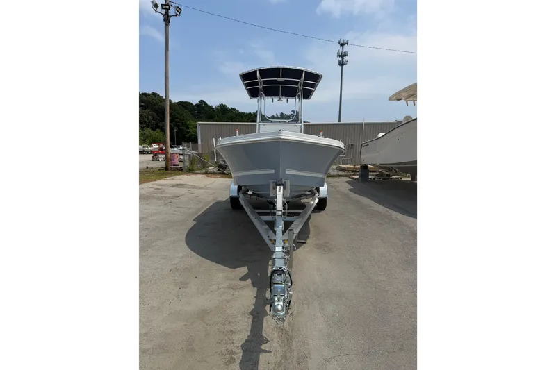 The Image of Front view of a 2027 Parker 180 Coastal boat on a trailer in a parking lot. - 0