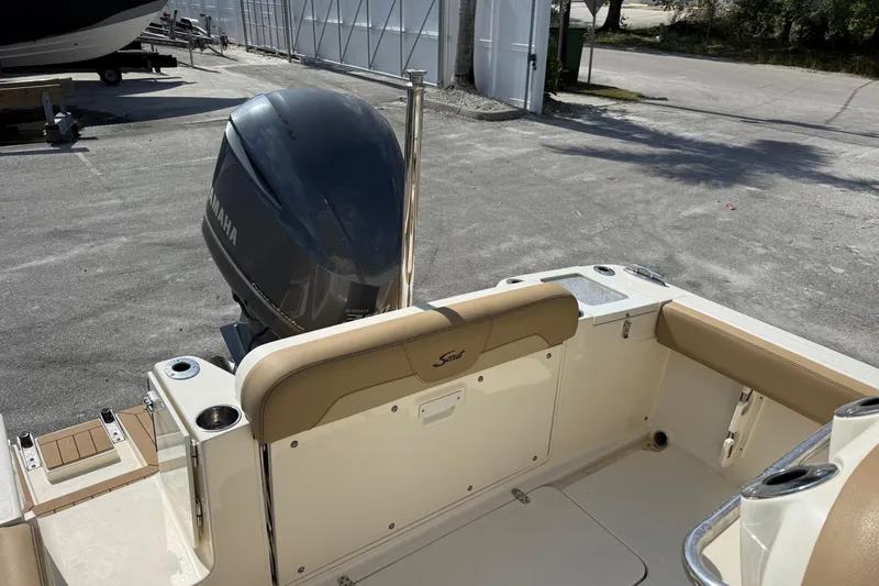 Slide: The Image of 2018 Scout 235 XSF boat with Yamaha outboard motor, docked outdoors. - 5