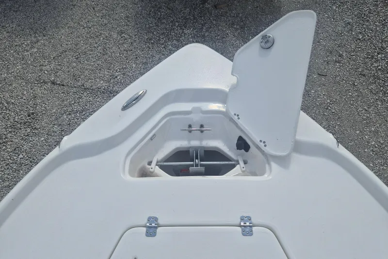 Slide: The Image of Bow view of 2026 Key West 210 Bay Reef boat with open anchor hatch. - 13