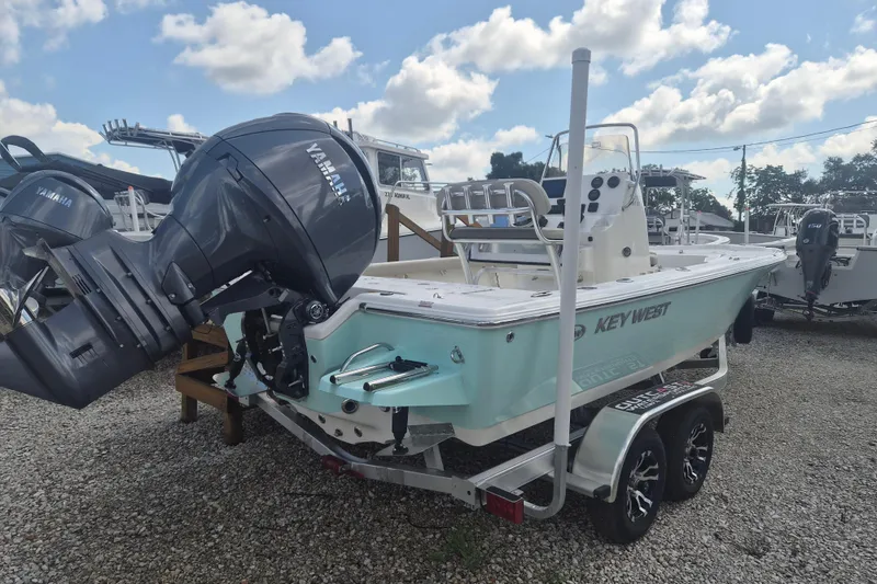 Slide: The Image of 2026 Key West 210 Bay Reef boat with Yamaha outboard motor on trailer. - 2