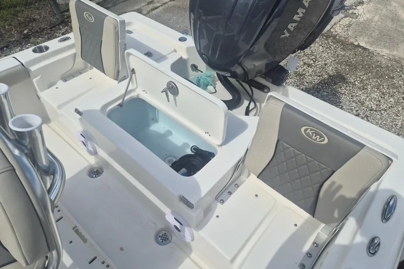 Slide: The Image of 2026 Key West 210 Bay Reef boat interior with Yamaha engine and seating. - 7