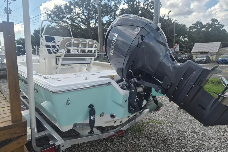 Slide: The Image of 2026 Key West 210 Bay Reef boat with Yamaha outboard motor, parked on a trailer. - 3