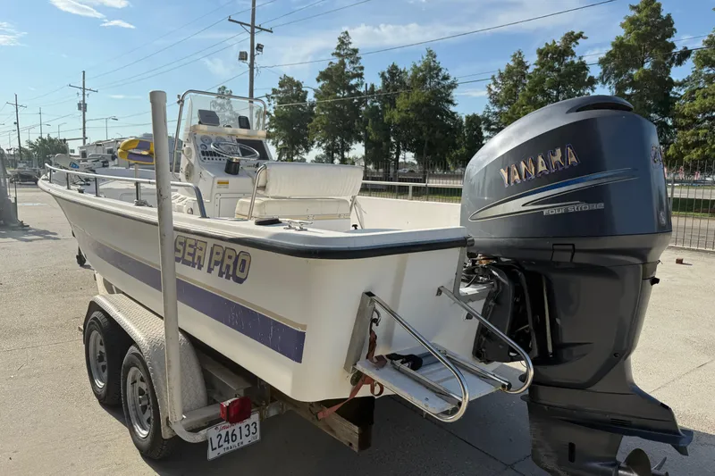 Slide: The Image of 2002 Sea Pro SV2400CC Bay Boat on trailer with Yamaha outboard motor. - 9