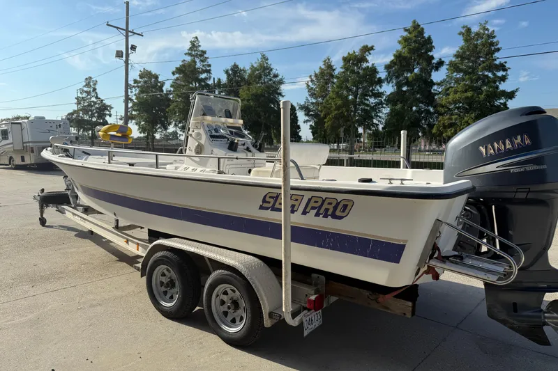 Slide: The Image of 2002 Sea Pro SV2400CC Bay Boat on trailer with Yamaha outboard motor. - 8