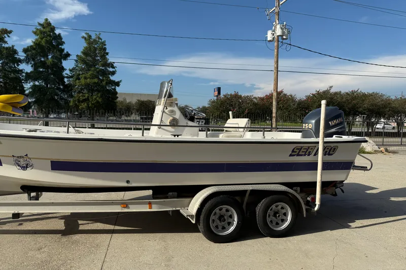 Slide: The Image of 2002 Sea Pro SV2400CC Bay Boat on trailer, featuring Yamaha 250 engine. - 7