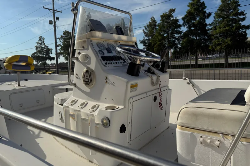 Slide: The Image of 2002 Sea Pro SV2400CC Bay Boat cockpit with steering console and seating. - 11
