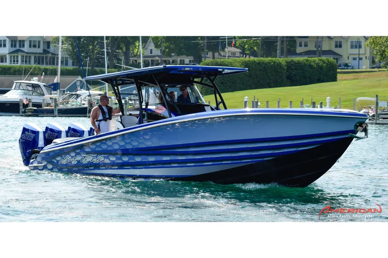Slide: The Image of 2025 Nor-Tech 390 Sport Center Console boat cruising on a sunny day. - 2