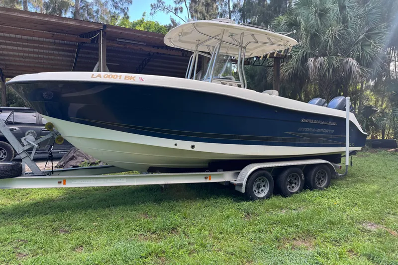 Slide: The Image of 2007 Hydra-Sports Vector 2500 CC boat on trailer, parked outdoors near trees. - 1