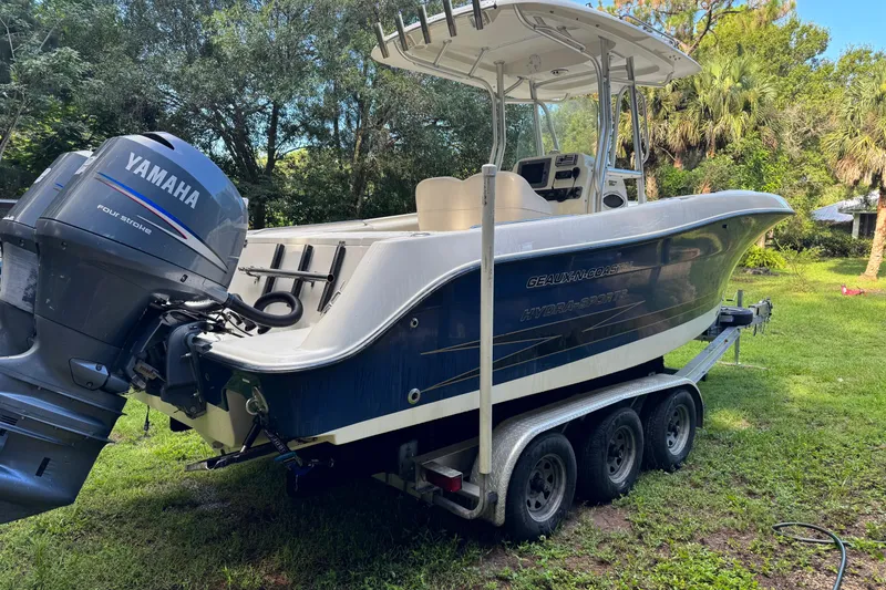 Slide: The Image of 2007 Hydra-Sports Vector 2500 CC boat on trailer with Yamaha outboard motor in a grassy area. - 4