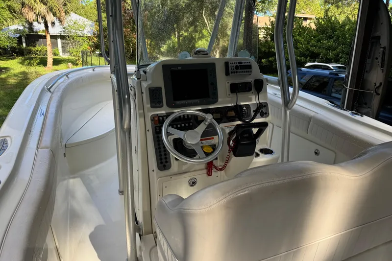 Slide: The Image of 2007 Hydra-Sports Vector 2500 CC boat cockpit with steering wheel and navigation equipment. - 21