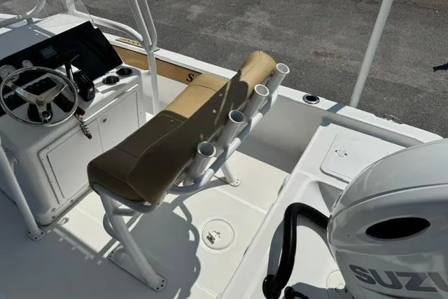 Slide: The Image of Interior view of a 2022 Savannah 190 IS boat with steering console and seating. - 12