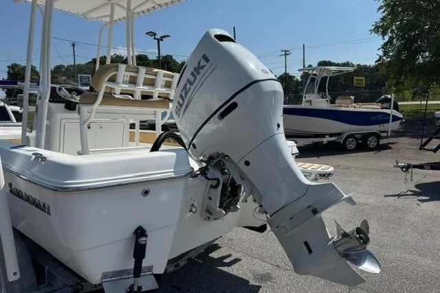 Slide: The Image of 2022 Savannah 190 IS boat with Suzuki outboard motor in a sunny outdoor setting. - 6